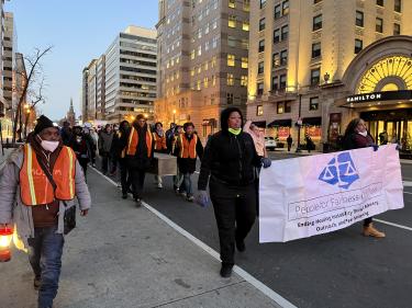 PFFC members marching with a PFFC sign